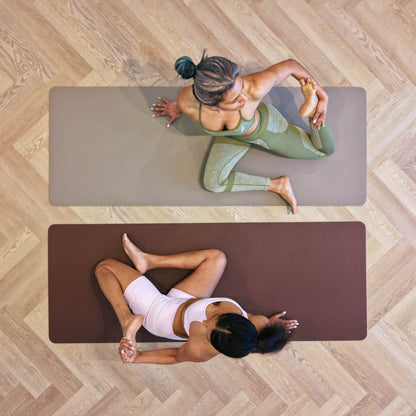 Two women stretching on Sandstone and Mahogany Zenvibes waterproof vegan leather yoga mats, top view on a timber floor