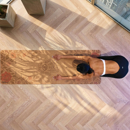 Woman practicing yoga on a Zenvibes Hamsa Harmony extra wide cork yoga mat.